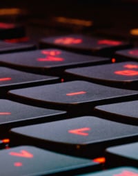 laptop keyboard with red glow